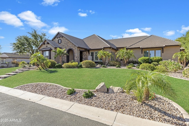 6918 E Ivyglen St, Mesa, AZ 85207 - view of front facade with stone siding, stucco siding, a front lawn, and a tile roof