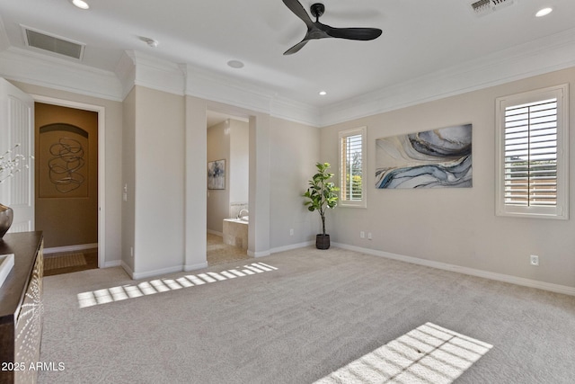 6918 E Ivyglen St, Mesa, AZ 85207 - carpeted bedroom with ornamental molding, recessed lighting, baseboards, and connected bathroom