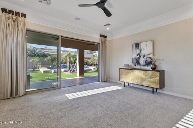 6918 E Ivyglen St, Mesa, AZ 85207 - carpeted empty room featuring ornamental molding, plenty of natural light, a ceiling fan, and baseboards