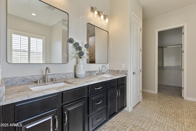 6918 E Ivyglen St, Mesa, AZ 85207 - bathroom with double vanity and baseboards