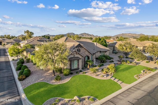 6918 E Ivyglen St, Mesa, AZ 85207 - view of front facade featuring a residential view, a front yard, and stucco siding