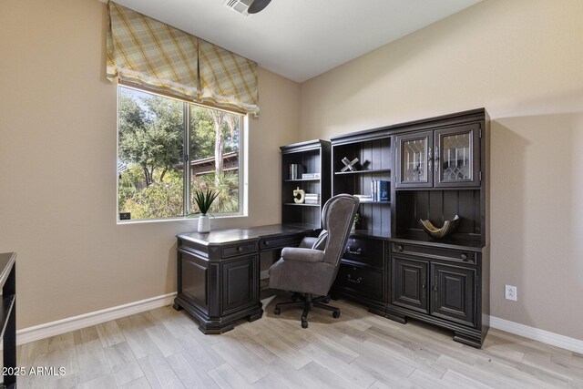6918 E Ivyglen St, Mesa, AZ 85207 - home office featuring baseboards and light wood-style flooring