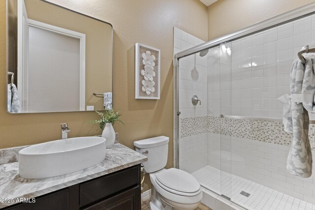 6918 E Ivyglen St, Mesa, AZ 85207 - full bathroom featuring vanity, a stall shower, and toilet