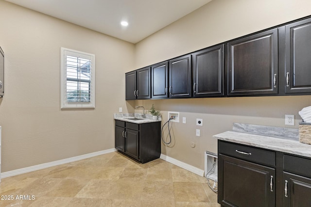 6918 E Ivyglen St, Mesa, AZ 85207 - washroom with electric dryer hookup, hookup for a washing machine, cabinet space, gas dryer hookup, and baseboards