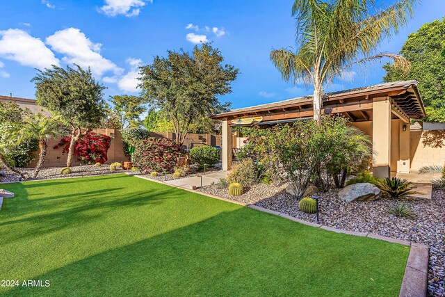 6918 E Ivyglen St, Mesa, AZ 85207 - view of yard featuring a patio area