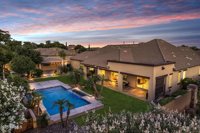 6918 E Ivyglen St, Mesa, AZ 85207 - rear view of property featuring stucco siding, a tiled roof, a patio, and a yard