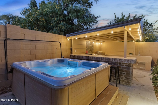 6918 E Ivyglen St, Mesa, AZ 85207 - view of patio with a hot tub