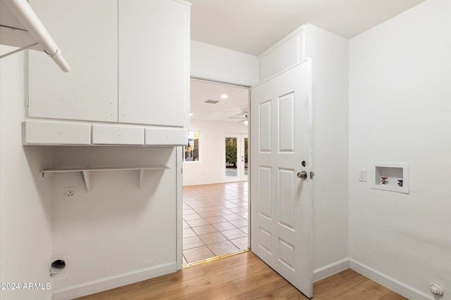 laundry area featuring washer hookup, ceiling fan, electric dryer hookup, and light hardwood / wood-style flooring