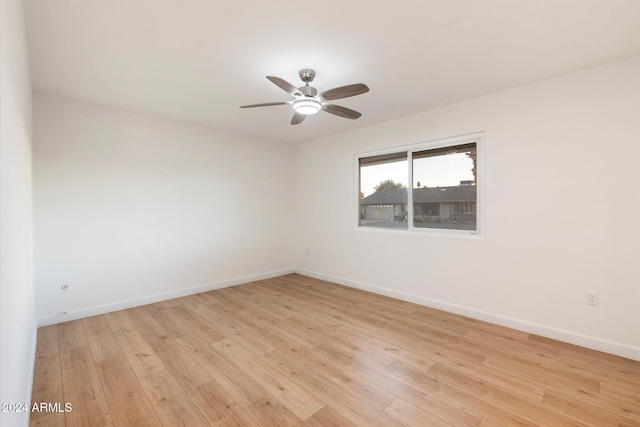 spare room with light hardwood / wood-style floors