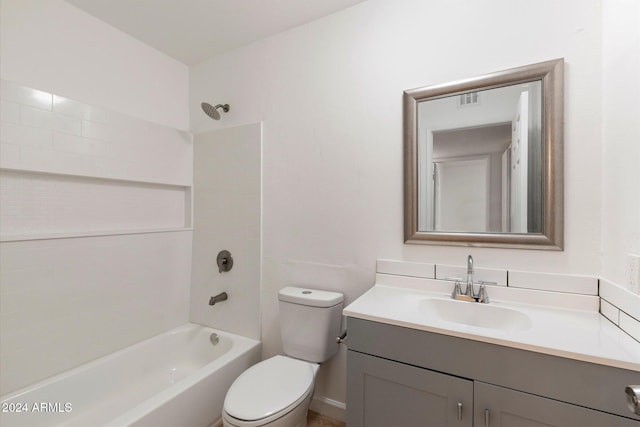 full bathroom featuring shower / tub combination, vanity, and toilet