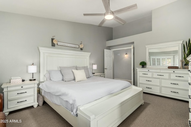 bedroom featuring dark carpet, ceiling fan, and lofted ceiling