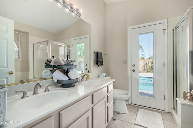 bathroom featuring a sink, tile patterned flooring, a shower stall, and double vanity