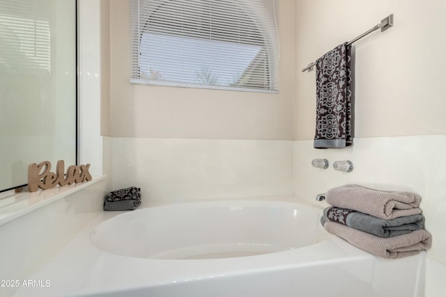 full bathroom with a garden tub