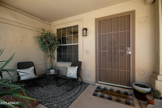 entrance to property with stucco siding