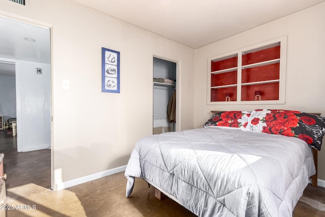 bedroom featuring baseboards, a closet, and finished concrete floors