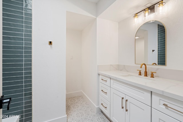 bathroom featuring tile patterned flooring and vanity