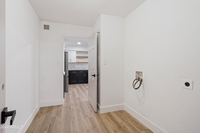 corridor featuring light hardwood / wood-style flooring