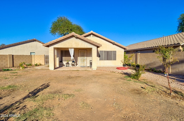 rear view of property with a patio