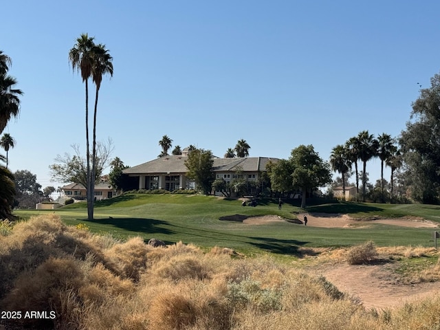 view of home's community with a lawn