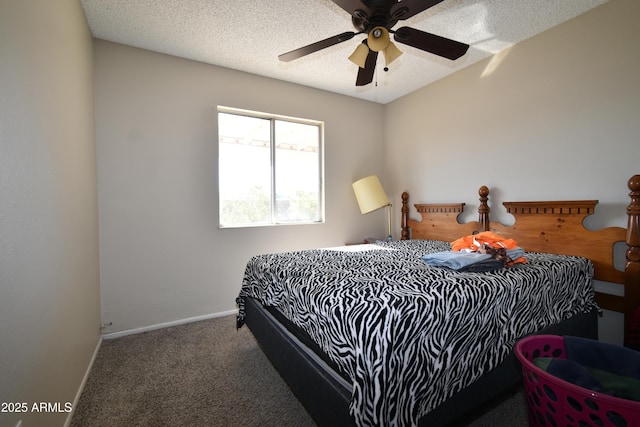 carpeted bedroom featuring a textured ceiling and ceiling fan