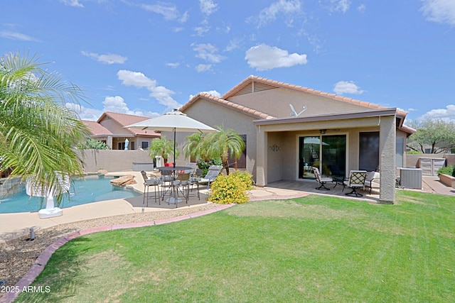 rear view of house featuring a patio area, cooling unit, stucco siding, and a tiled roof