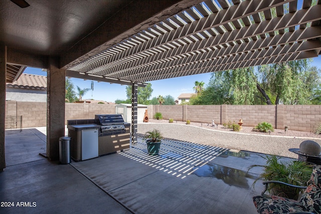 view of patio with a pergola and grilling area