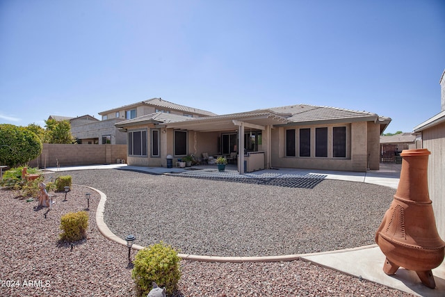 rear view of house with a patio