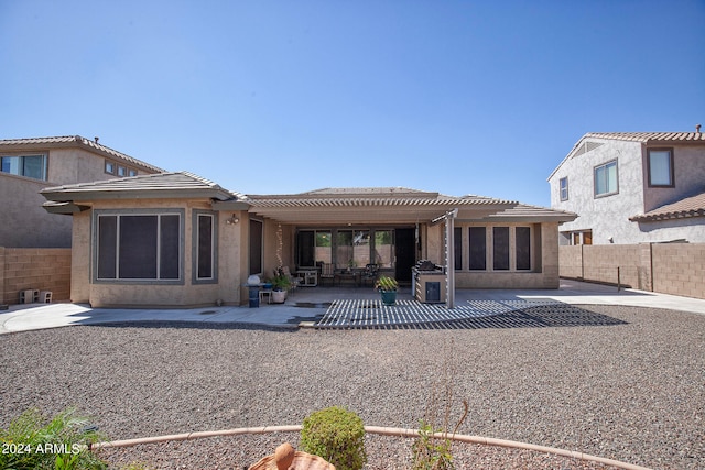 back of property with a patio and a pergola