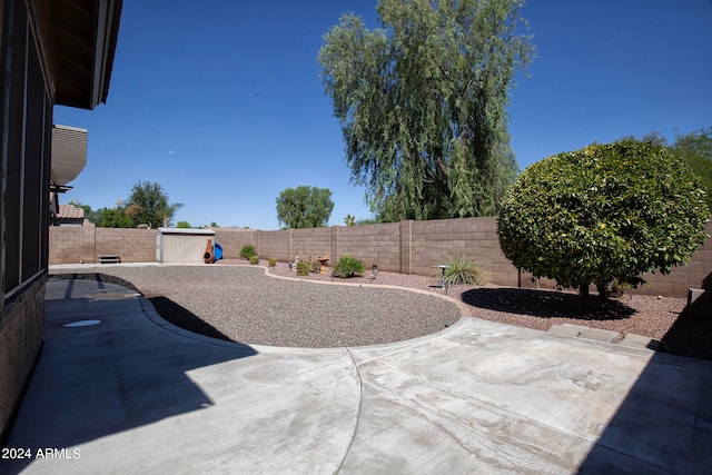 view of patio with a storage unit