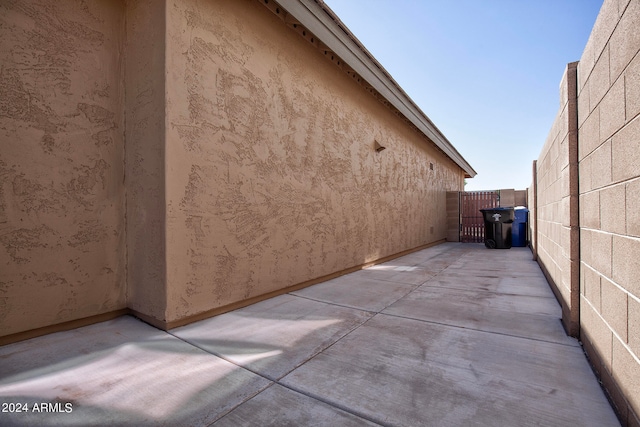 view of side of home with a patio area