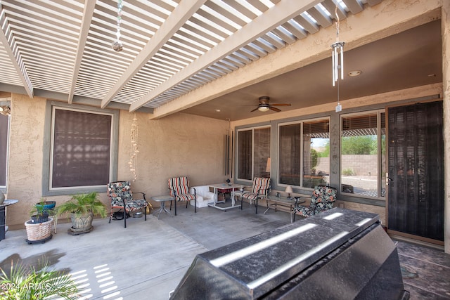 view of patio / terrace featuring ceiling fan and a pergola