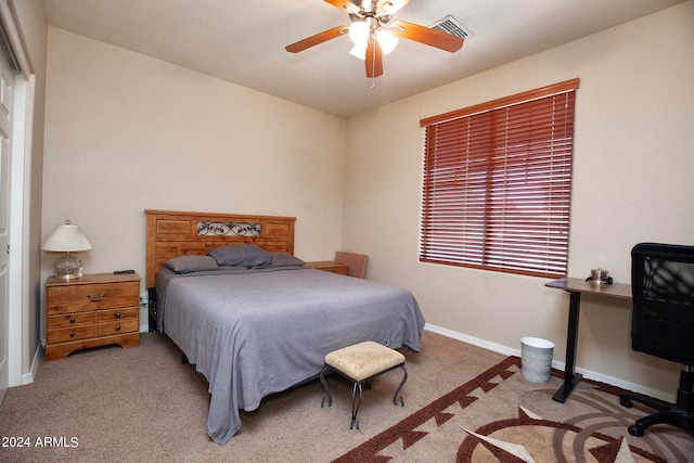 bedroom with light colored carpet and ceiling fan