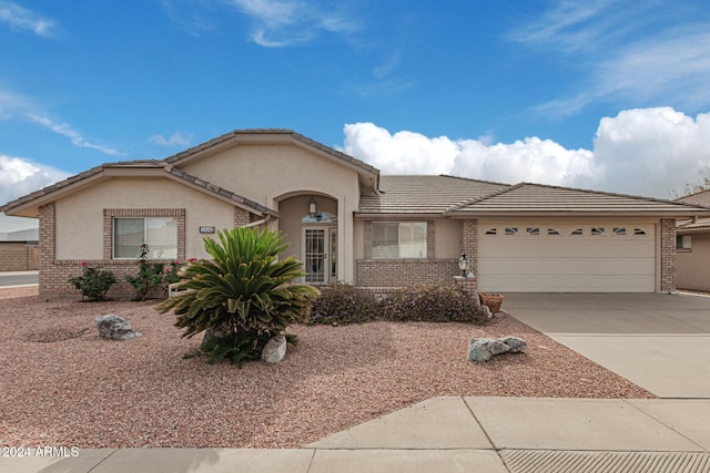 ranch-style home featuring a garage