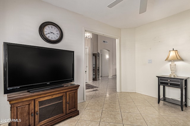 living room featuring ceiling fan and light tile patterned flooring