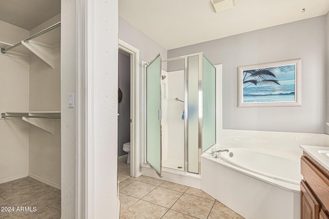 full bathroom featuring separate shower and tub, tile patterned flooring, vanity, and toilet