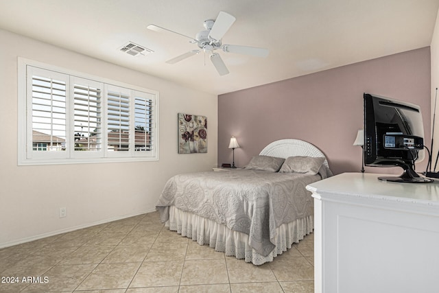 bedroom featuring ceiling fan and light tile patterned flooring