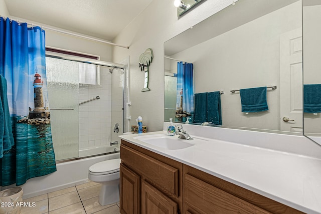 full bathroom featuring tile patterned floors, vanity, shower / bath combination with curtain, and toilet