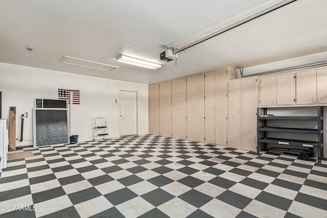 garage featuring a garage door opener and wood walls