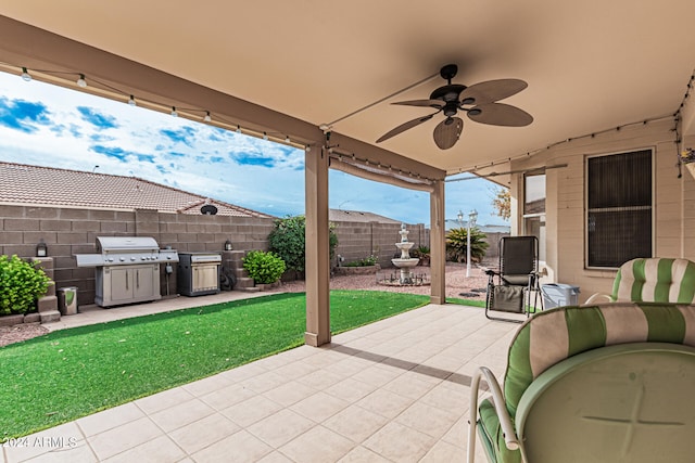 view of patio / terrace featuring area for grilling and ceiling fan