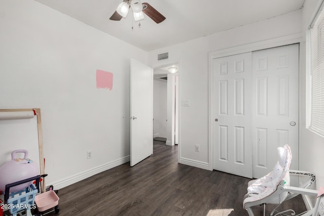 9046 N 51st Ln, Glendale, AZ 85302 - bedroom featuring a closet, baseboards, dark wood finished floors, visible vents, and ceiling fan