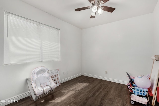 9046 N 51st Ln, Glendale, AZ 85302 - unfurnished room featuring dark wood-style flooring, baseboards, and a ceiling fan
