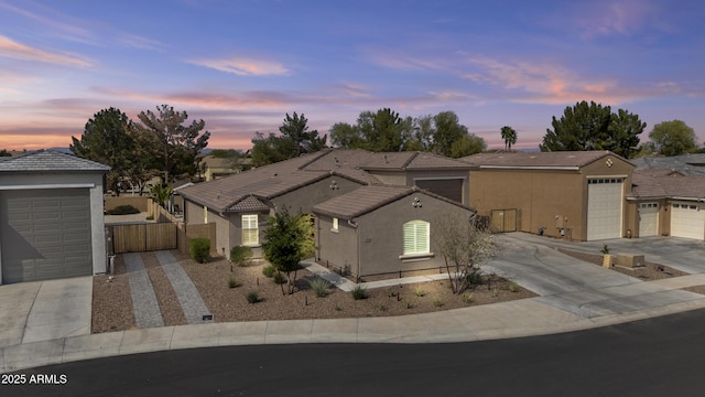 14370 W Hearn Rd, Surprise, AZ 85379 - single story home featuring a tile roof, a gate, concrete driveway, stucco siding, and fence