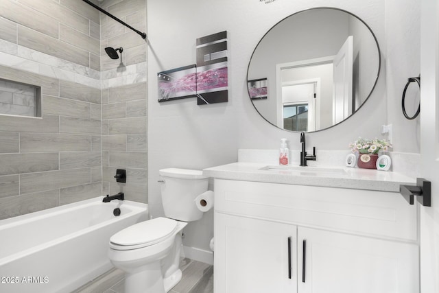 full bathroom with vanity, toilet, wood-type flooring, and tiled shower / bath combo