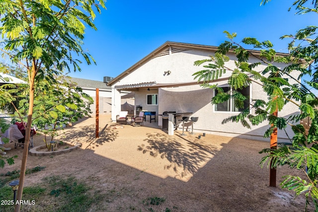 back of property featuring a patio area