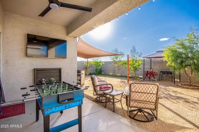 view of patio featuring a gazebo and ceiling fan