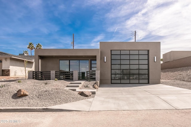 392 Schoppman Ln, Page, AZ 86040 - contemporary home with a garage, stucco siding, and driveway