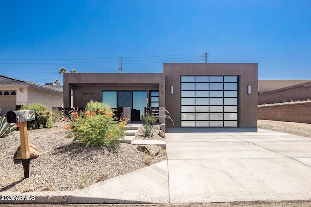 392 Schoppman Ln, Page, AZ 86040 - contemporary house featuring concrete driveway, a garage, and stucco siding