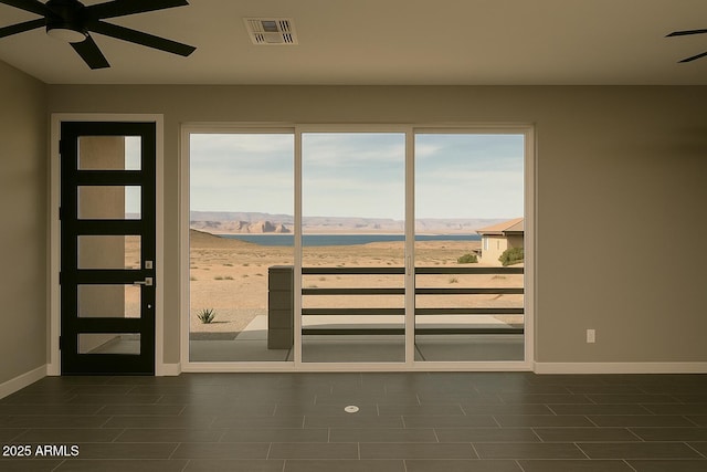 392 Schoppman Ln, Page, AZ 86040 - empty room featuring a ceiling fan, baseboards, visible vents, and a water view