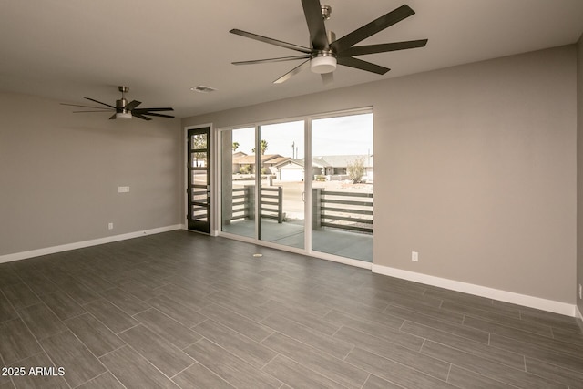 392 Schoppman Ln, Page, AZ 86040 - empty room with baseboards, a ceiling fan, dark wood-type flooring, and visible vents
