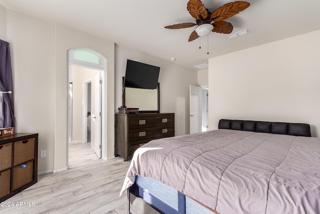 bedroom with light wood-type flooring and ceiling fan